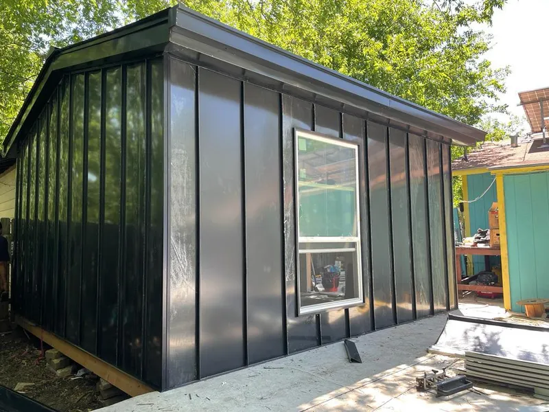 Black standing seam metal wall panels for Roof Inspection in Corinth